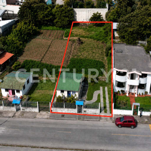 Terreno 884m² en Sangolquí: casa + huerto, uso residencial o comercial